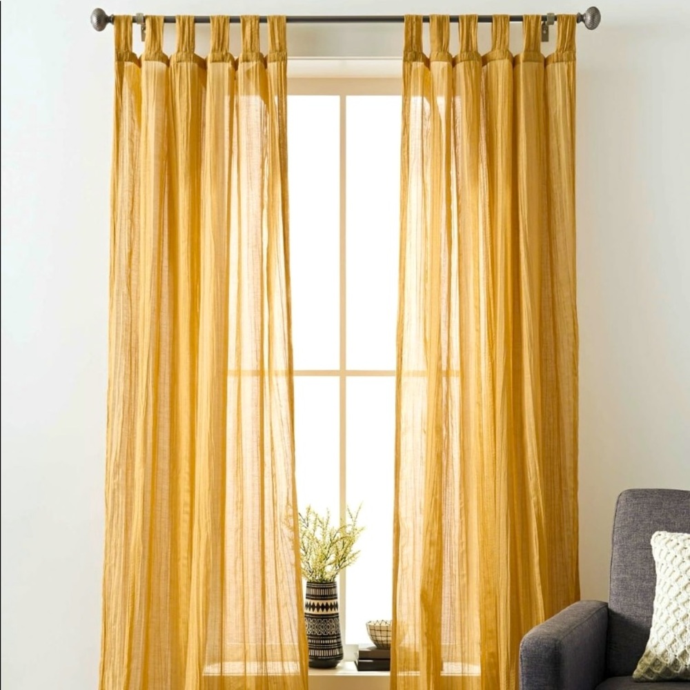 Solid sheer two single curtain panels.
